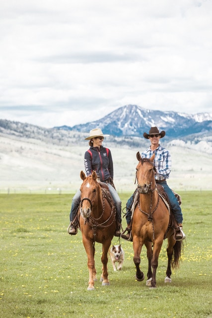 Couple on horseback at the ranch