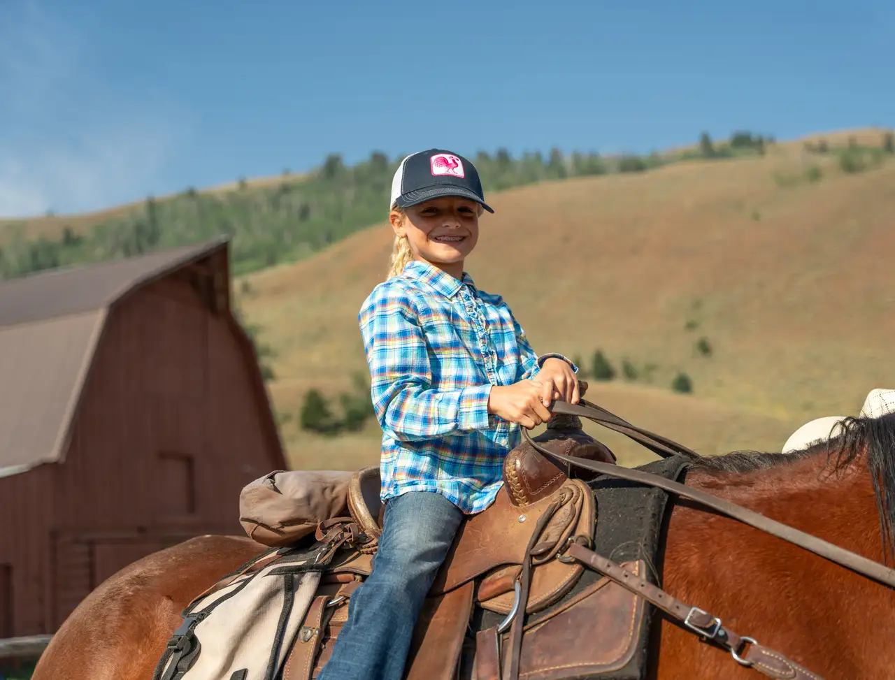 A girl riding a horse