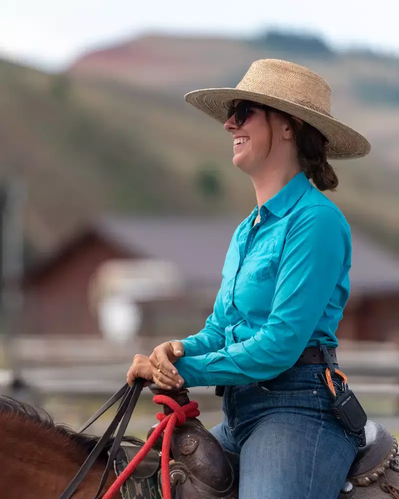 A woman riding a horse